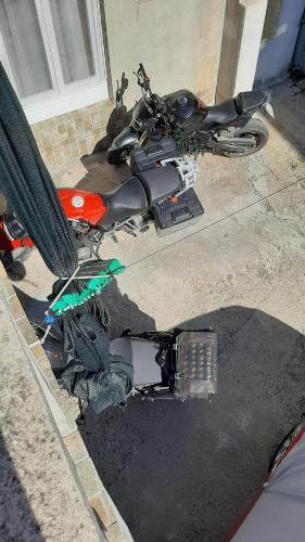 a motorcycle parked on the side of a street at Apartment Jasna in Mostar