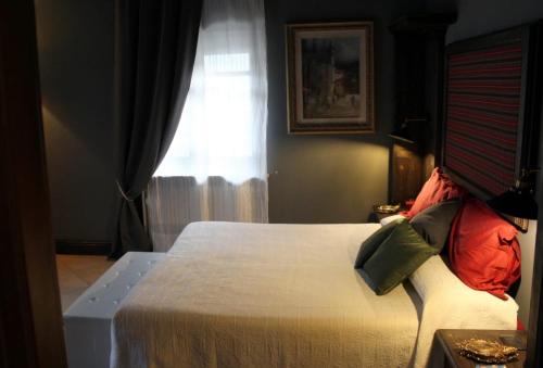 a bedroom with a large bed with a window at Un sorriso sul Viso in Martiniana Po