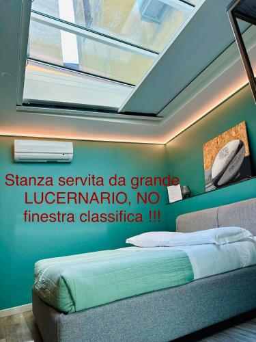 Letto o letti in una camera di Dimora del Teatro
