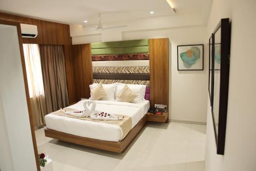 a bedroom with a bed in a room at Lords Eco Inn, Ambaji in Ambaji