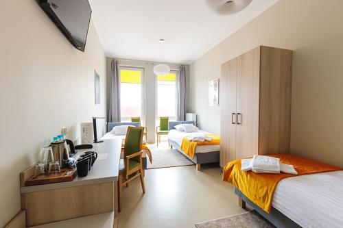Posteľ alebo postele v izbe v ubytovaní Antonińska Hotel & Apartamenty