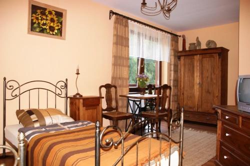 Tempat tidur dalam kamar di Siedlisko Brzeziniak