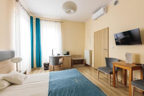 TV a/nebo společenská místnost v ubytování Antonińska Hotel & Apartamenty