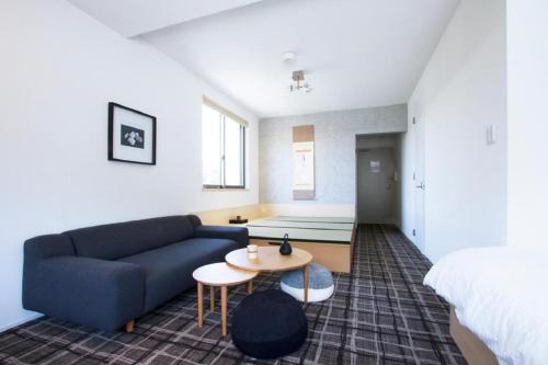 a living room with a couch and a table at Sweet Stay Kyoto - Vacation STAY 21712v in Kyoto
