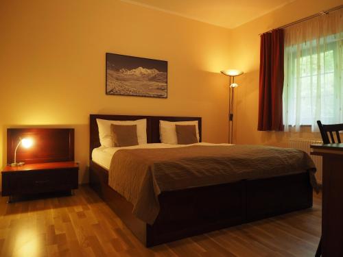 Postel nebo postele na pokoji v ubytování Hotel Výpřež - Děčín