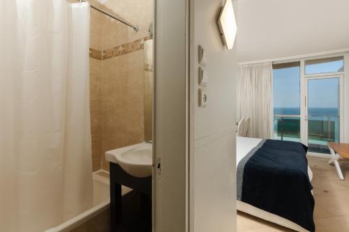 Ένα ή περισσότερα κρεβάτια σε δωμάτιο στο Residence Hotel