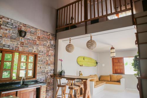 a kitchen with a sink and a counter in a room at Vila hangloose Jericoacoara in Acaraú