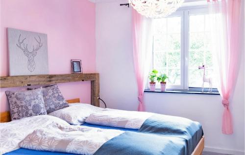 a bedroom with a bed and a window at Pet Friendly Home In Hirtenberg With Kitchen in Hirtenberg
