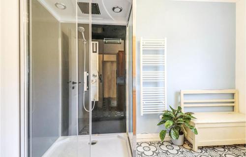 a bathroom with a shower and a potted plant at Pet Friendly Home In Hirtenberg With Kitchen in Hirtenberg