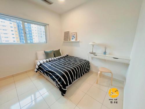 a bedroom with a bed and a desk and a window at A Private Room With Private Bathroom & Private Entrance,15 mins to KLIA, KLIA2, Sepang- Host By Private Locals Resident, Provide Paid Airport Transport Service, Downstairs Eatery & MCD, Petrol Station, ATM, 7-11 in Kampong Bekoh
