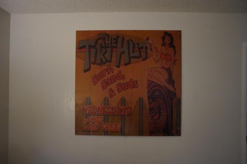 a painting hanging on a wall in a room at Huntington Surf Inn in Huntington Beach