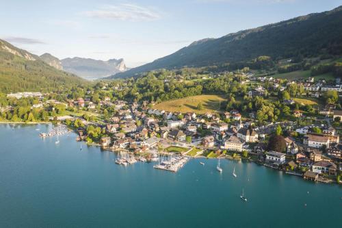 an aerial view of a small town on a lake at Apartment Ferienwohnung DAS UNTERACH am Attersee in Unterach am Attersee