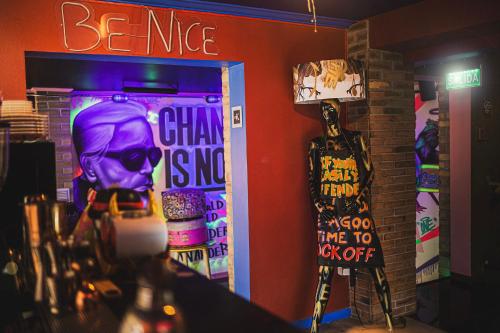 a room with a door with a sign and a skateboard at hotel velero cavancha in Iquique