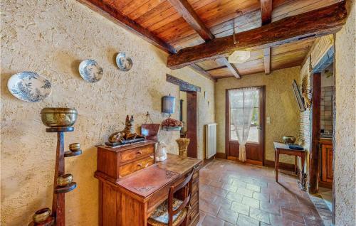 a kitchen with a wooden table in a room at Nice Home In St Pierre Deyraud With Private Swimming Pool, Can Be Inside Or Outside in La Force