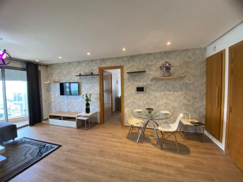 a living room with a table and chairs at Casablanca Marina by Saloua in Casablanca