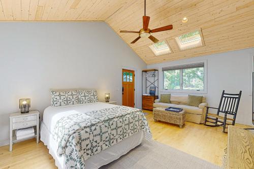 a bedroom with a bed and a ceiling fan at Harborwalk Lower and Studio in Camden