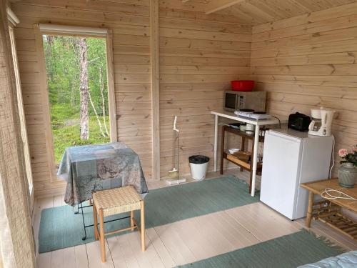 Kuchyň nebo kuchyňský kout v ubytování Lemmenjoen Lumo - Nature Experience & Accommodation