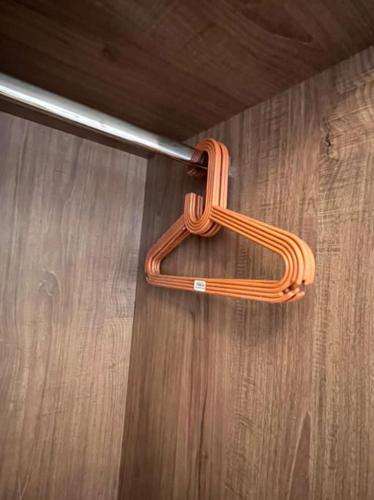 a wooden object hanging from a pole on a wooden floor at 2 bedroom apartement in the center of cairo in Cairo