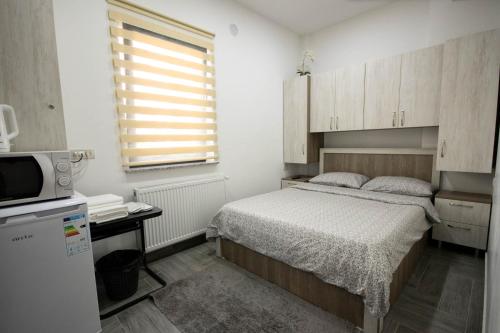 Ένα ή περισσότερα κρεβάτια σε δωμάτιο στο AStar Apartments - SMALL