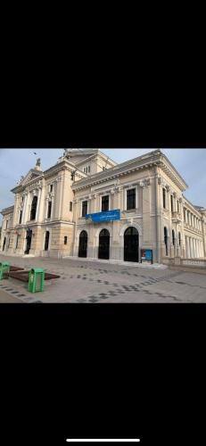 a large white building in front of a street at Bulevard Residence in Drobeta-Turnu Severin