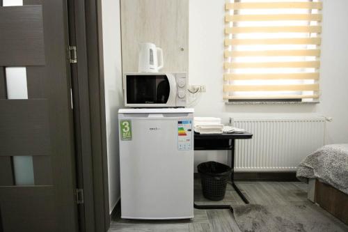 Kuchyň nebo kuchyňský kout v ubytování AStar Apartments - SMALL