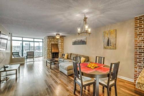 a living room with a table and a couch at 2 BR Condo Heart of LoDo w/Great View/Amenities in Denver