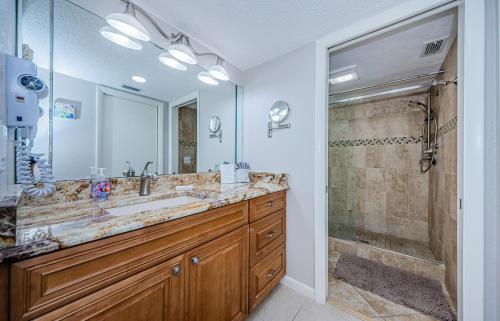 a bathroom with a large sink and a shower at Sonrisa 1 in Clearwater Beach