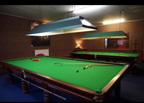 a room with a pool table with balls on it at Kilconquhar castle estate villa 6, 4 bed sleeps 10 in Fife