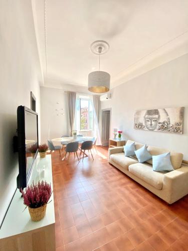 a living room with a couch and a table at Upi-Up Rome Staying in Rome