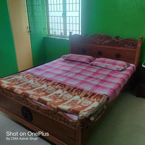 Ліжко або ліжка в номері Dhanashree Guest House