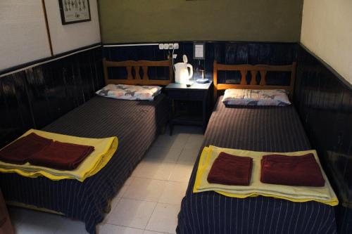 Katil atau katil-katil dalam bilik di Abra Marina Hotel