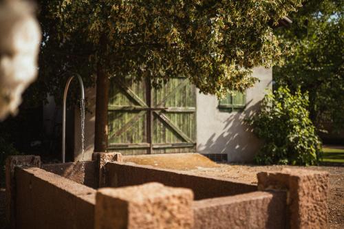 a fence with a large window in front of a building at Agriturismo Insolito in Terlano