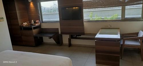 Postel nebo postele na pokoji v ubytování Hotel Cosmopolitan