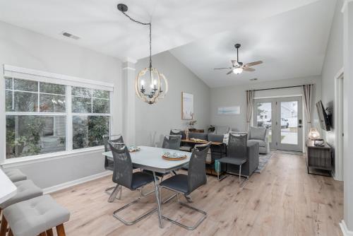 a dining room and living room with a table and chairs at Encanto of the Lowcountry in Old Town Bluffton in Bluffton