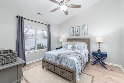 a bedroom with a bed and a ceiling fan at Encanto of the Lowcountry in Old Town Bluffton in Bluffton