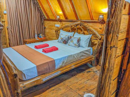 Ένα ή περισσότερα κρεβάτια σε δωμάτιο στο Wooden Cabana Sigiriya