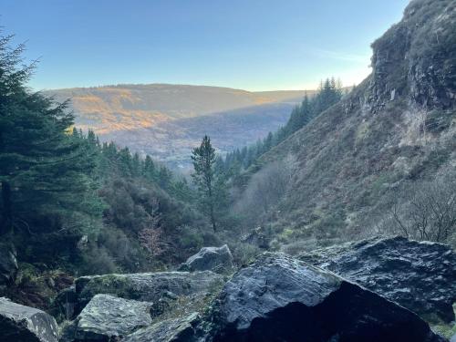 a view of a mountain with rocks and trees at Large Historic Farmhouse in Rhondda Valley Perfect for Groups with Hot Tub in Blaencwm