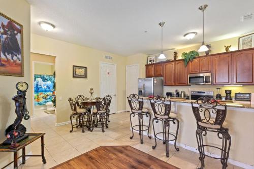 a kitchen with a table and chairs in a room at Executive 3 Bedroom Villa at Universal,Convention Center, Vista Cay in Orlando