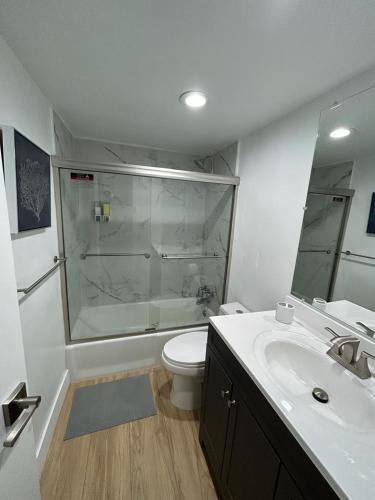 a bathroom with a shower and a toilet and a sink at NEW LUXURY APARTMENT 2Br 2Ba DIRECT BEACH ACCESS in Hollywood Beach