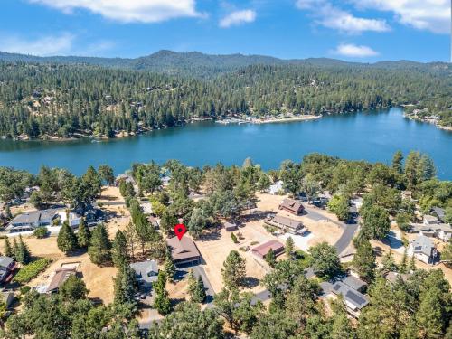 an aerial view of a lake with houses and trees at Fisherman's Cove Retreat - Game Room Included! home in Groveland