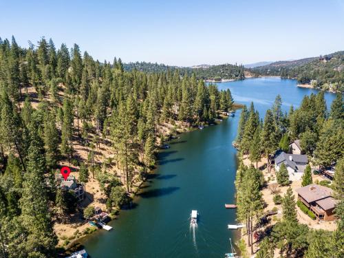 an aerial view of a river with houses and trees at Water's Edge - Gorgeous Water Views! home in Groveland