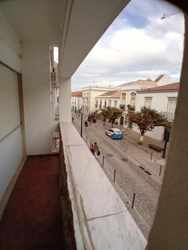 a view of a street from a window of a building at T3 1 andar Avenida Ref 003 in Tavira