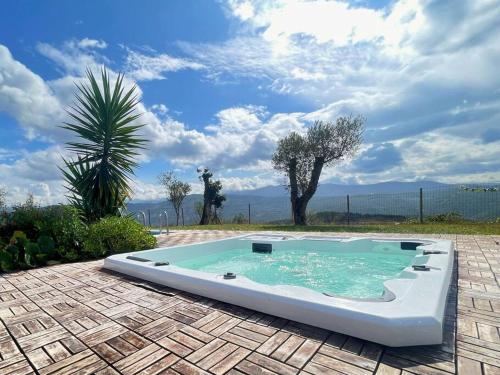 a swimming pool in the middle of a patio at Casas Coração in Codeçoso