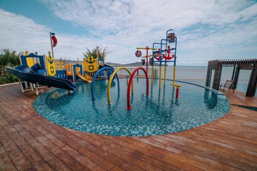 a water park with a water slide in the water at Kuantan Imperium Residence Studio With Netflix by I-Home in Kuantan