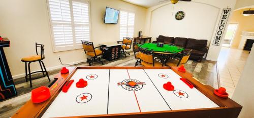 a living room with a ping pong table at North Phoenix At Your Fingertips in Phoenix