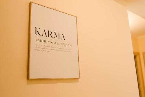 a framed sign on a wall in a room at Artemide Apartment in Montepaone Lido