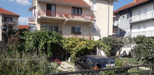 a black car parked in front of a building at Rooms Struga in Struga