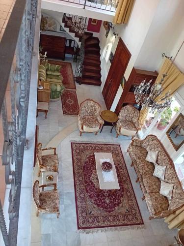 an overhead view of a living room with chairs and a table at Private Villa AKOBARA, 2km from city center in Corfu Town