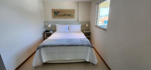 Llit o llits en una habitació de Porto Marina Itacuruçá Mangaratiba
