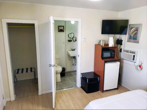 Kuchyň nebo kuchyňský kout v ubytování Rose's Motel
